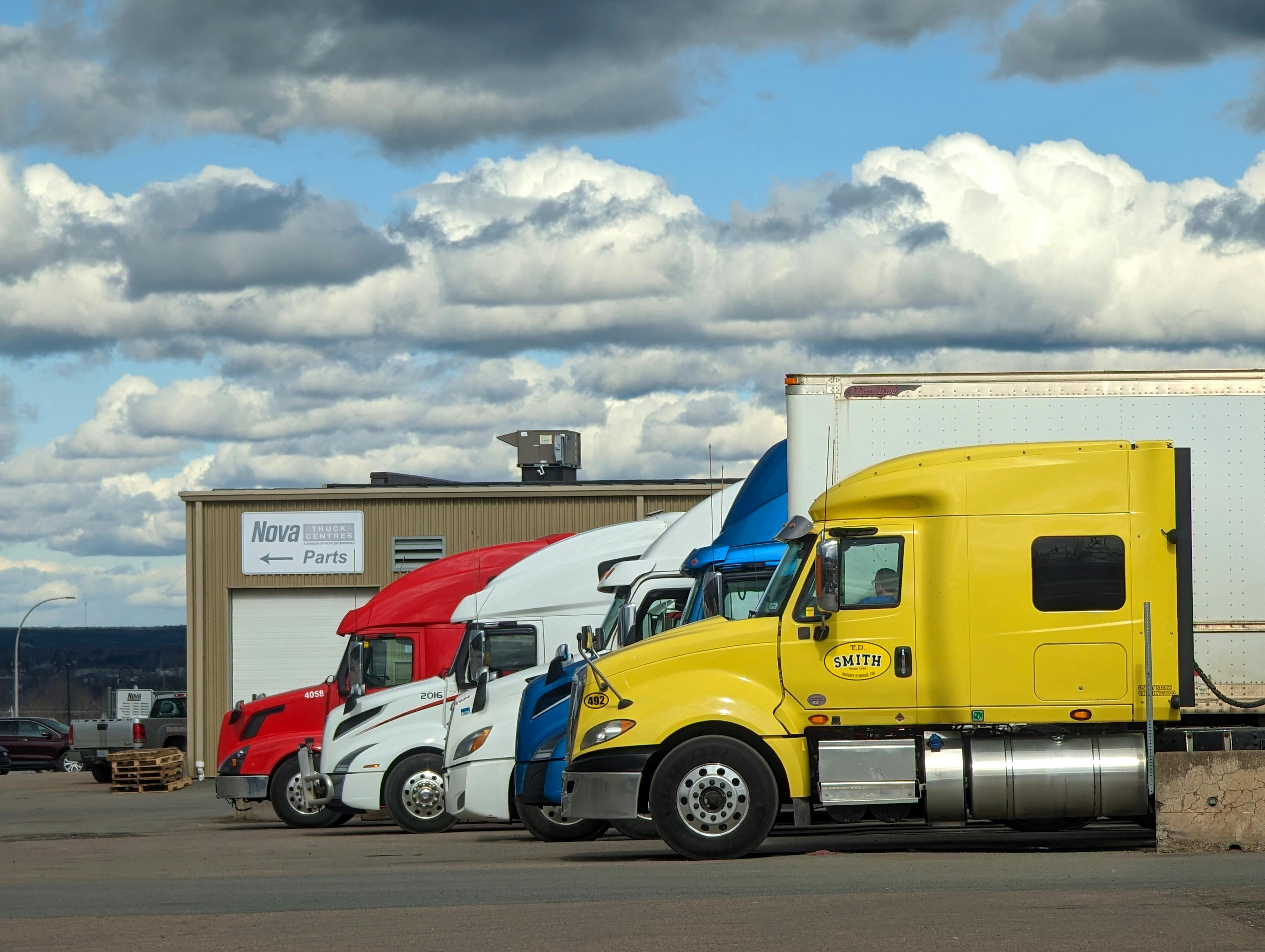 Highway trucks at sunset